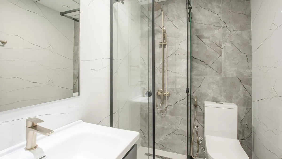 Newly tiled shower with glass door in Santa Clarita, CA